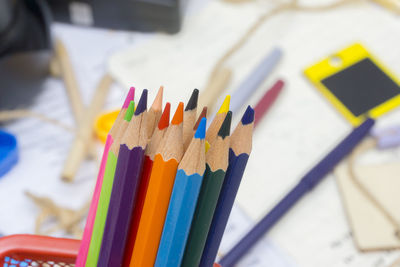 Close-up of colored pencils in container