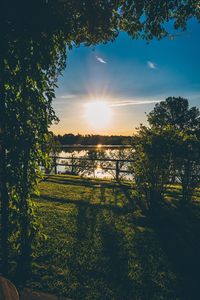 Scenic view of field against sky during sunset