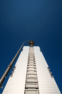 Low angle view of built structure against clear blue sky