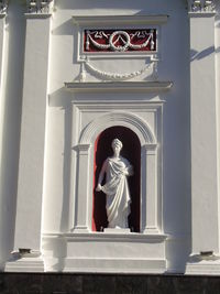 Low angle view of statue against temple