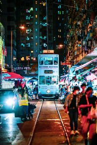 People on city street at night