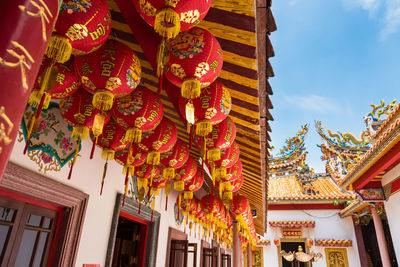 Low angle view of lanterns hanging outside temple