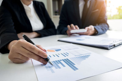 Close-up of hands working in office