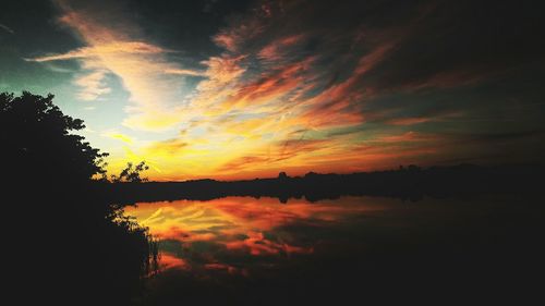 Scenic view of lake at sunset