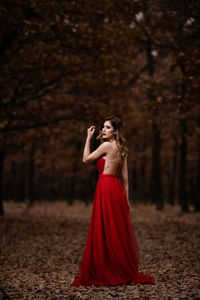 Woman standing in a forest