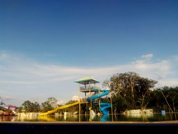 View of swimming pool against blue sky