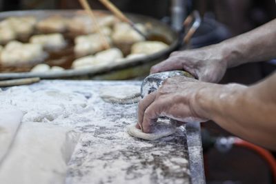 Man working on barbecue grill