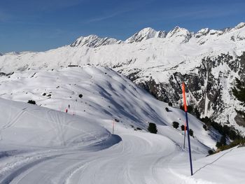 Scenic view of snowcapped mountains against sky