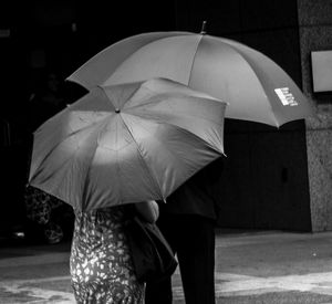 Full length of woman holding umbrella