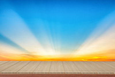 Low angle view of field against sky during sunset