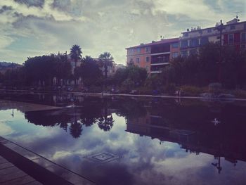 Reflection of buildings in calm lake