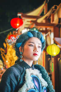 Portrait of a young woman looking away