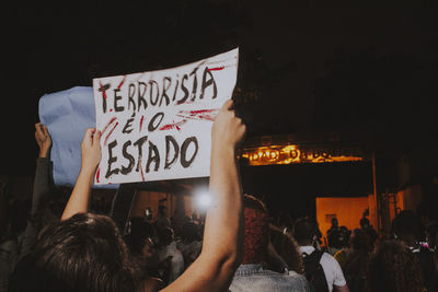 Group of people in front of crowd at night