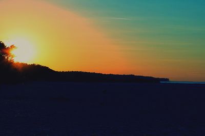 Scenic view of silhouette landscape against sky during sunset