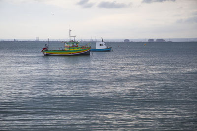 Nautical vessel on sea against sky