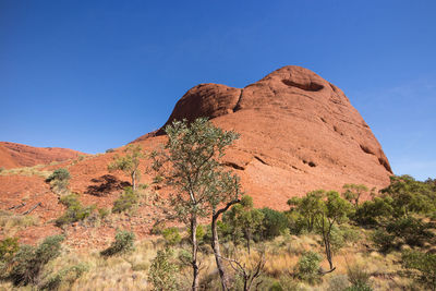 Scenic view of rocky mountains against clear blue sky