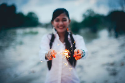 Portrait of a smiling young woman in water