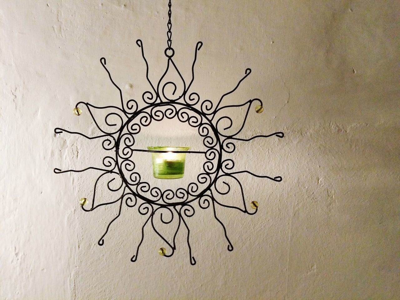 CLOSE-UP OF ELECTRIC LAMP ON WALL