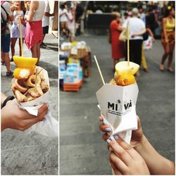 Midsection of woman holding ice cream in city