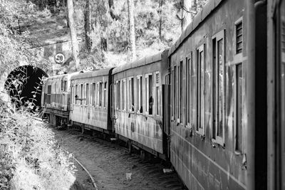 Toy train moving on mountain slope, beautiful view, 1 side mountain, 1 side valley moving