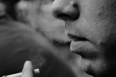 Close-up of man smoking cigarette