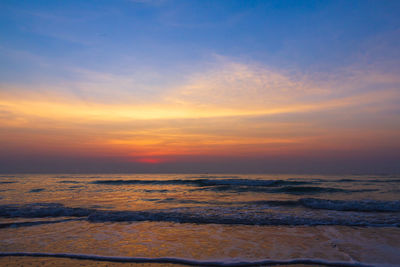 Scenic view of sea against romantic sky at sunset