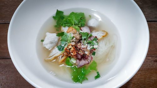 Clear noodles soup with pork and fish balls.