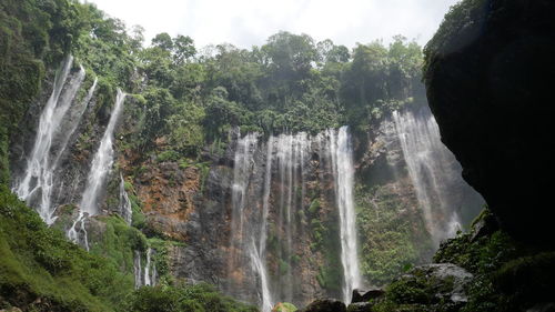 Underneatah tumpak sewu waterfall