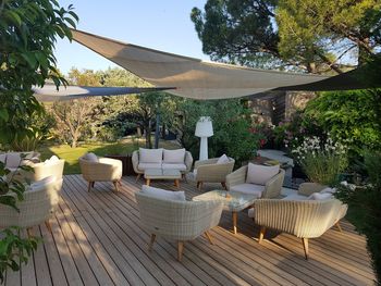 Chairs and tables against trees