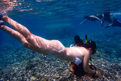 People swimming in sea