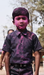 Portrait of young man standing outdoors