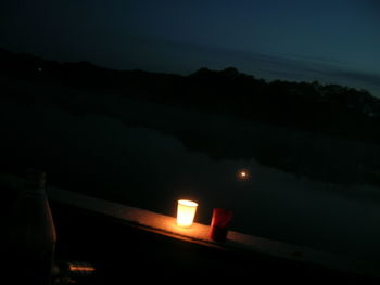 View of illuminated landscape against sky at night