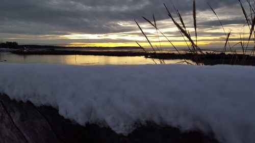 Scenic view of sea against cloudy sky