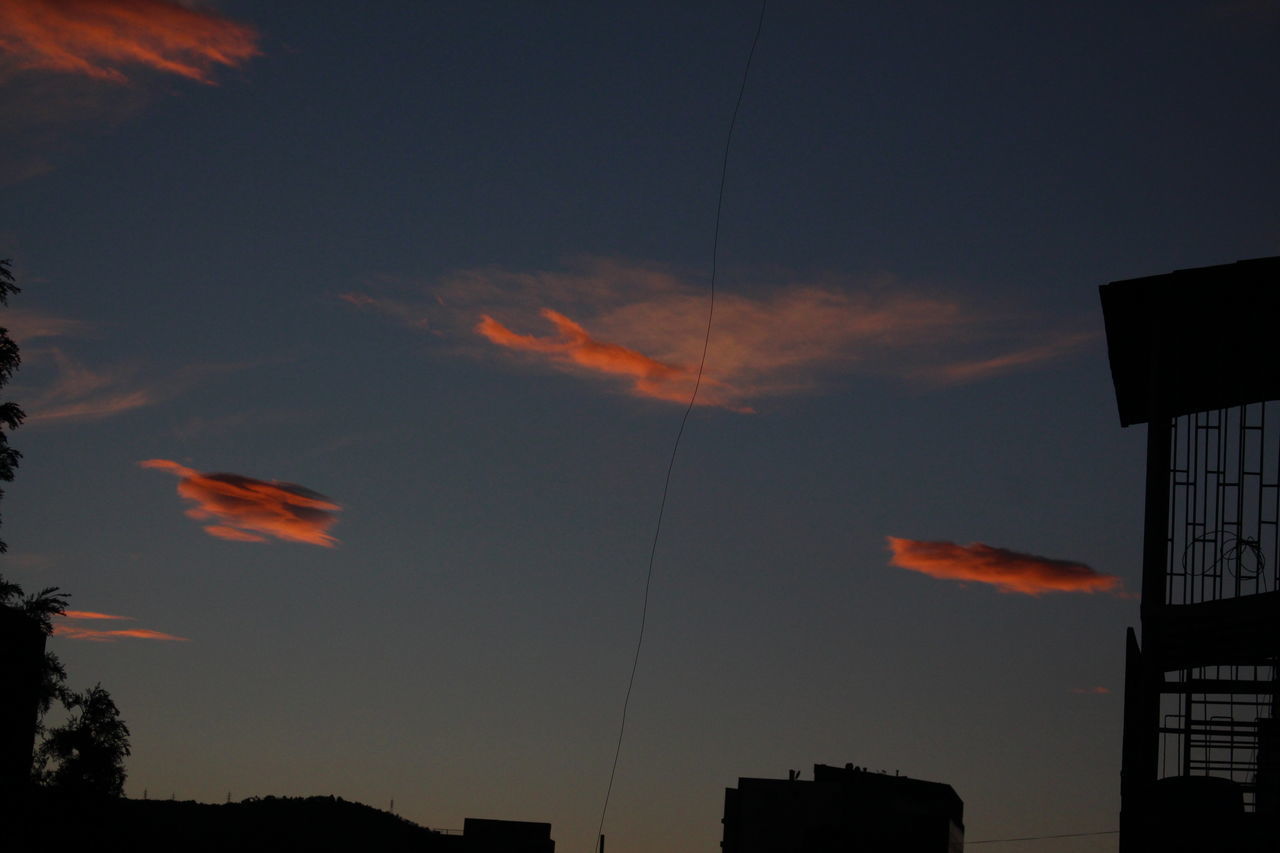 SILHOUETTE BUILDINGS AGAINST SKY AT SUNSET