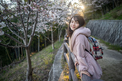 Portrait of woman against plants