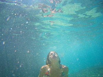 Woman swimming in sea