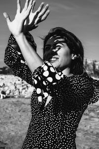 Young woman looking away outdoors