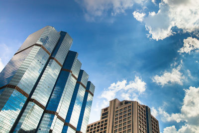 Low angle view of modern buildings against sky