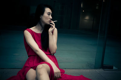 Thoughtful woman smoking