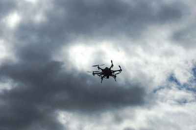 Low angle view of camera against sky