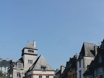 Low angle view of buildings against clear sky