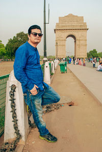 Full length of young man wearing sunglasses