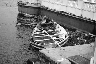 Abandoned boat moored in water