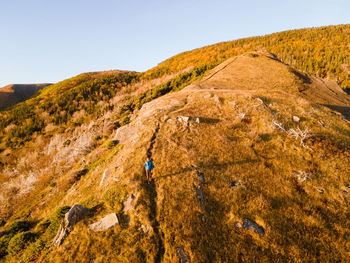 High angle view of man walking on hill
