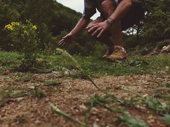 Midsection of man on field