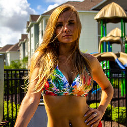 Beautiful woman in bikini against an outdoor background