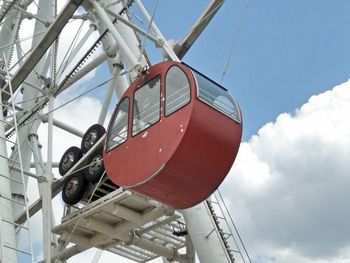 Low angle view of telephone pole against sky