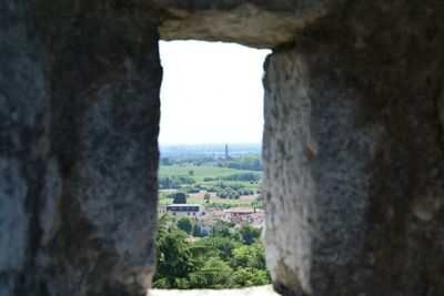 Castle against sky seen through arch