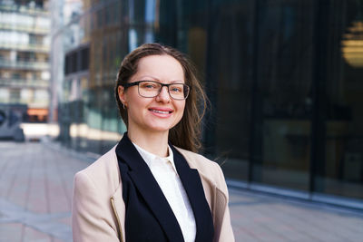 Female portrait of a business woman wearing glasses at the business center