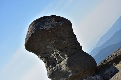 Low angle view of rock formation against sky